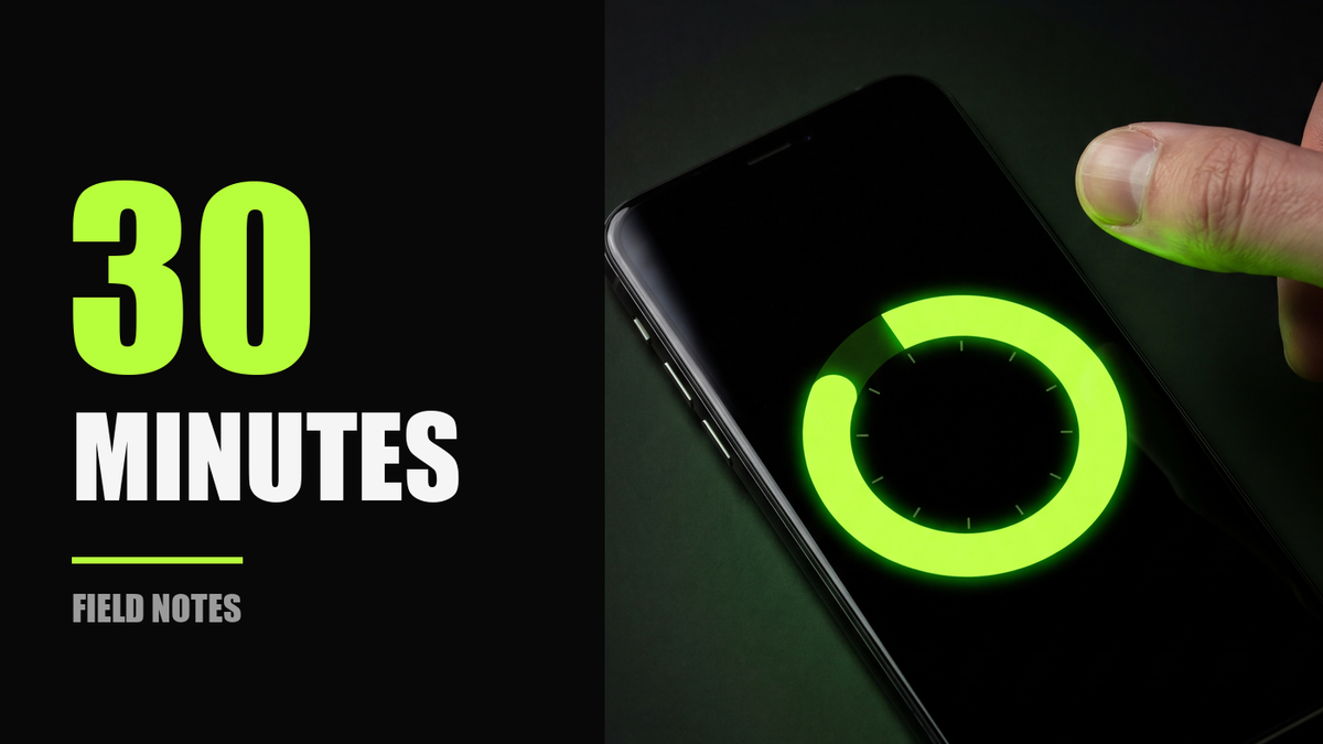 A phone lying face-up with a neon green timer ring on screen, beside the words 30 MINUTES